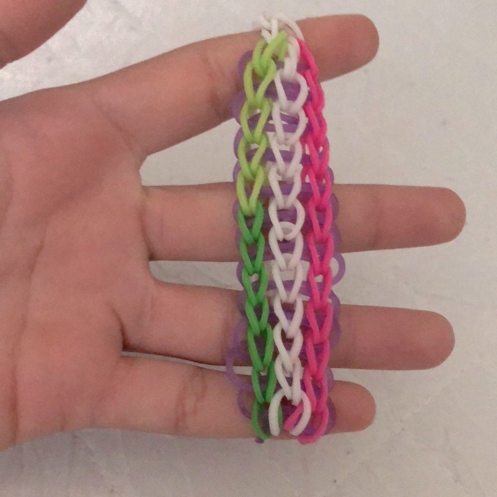 Rainbow loom, green, white, pink, purple, white.